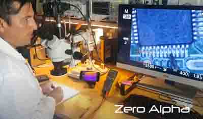 Using a microscope to identify surface mount electronics from a damaged SSD